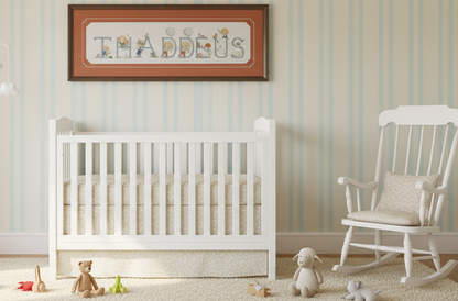 Graphic and pattern of the complete alphabet of 52 cross-stitch letters with designs for boys and girls