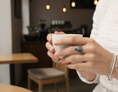 Geometric ring in the shape of a triangle