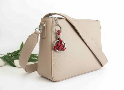 Porte-clés symbole celtique à cliquet en cuir et acier