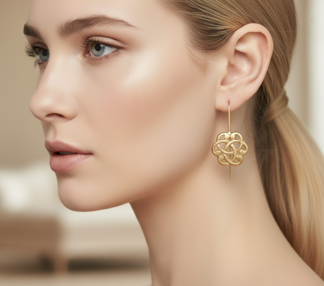 Gold earrings with Celtic triquetra symbol