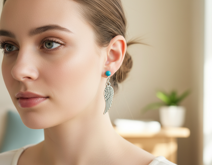 Pendientes largos con alas de ángel color turquesa