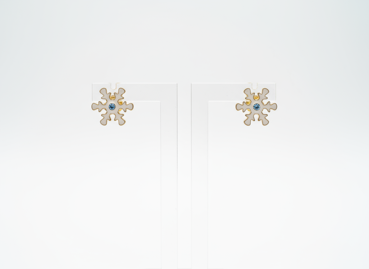Pendientes de botón con adorno de copo de nieve, con cristal central en tonos azules.