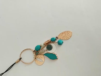 Bohemian leather necklace with turquoise and natural mother-of-pearl ornaments