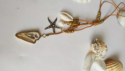Hippie pendant with seashells, starfish and mother of pearl