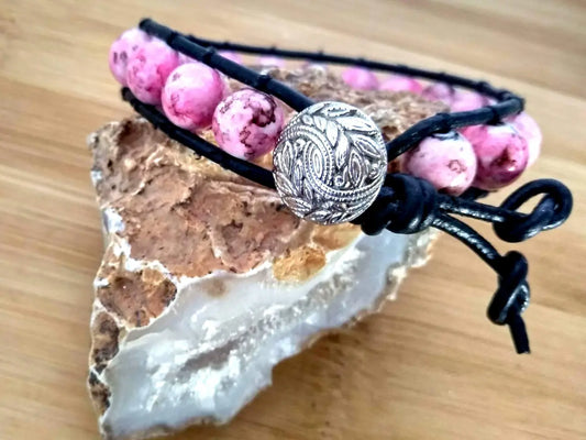 Bohemian style black leather bracelet with rhodonite beads.