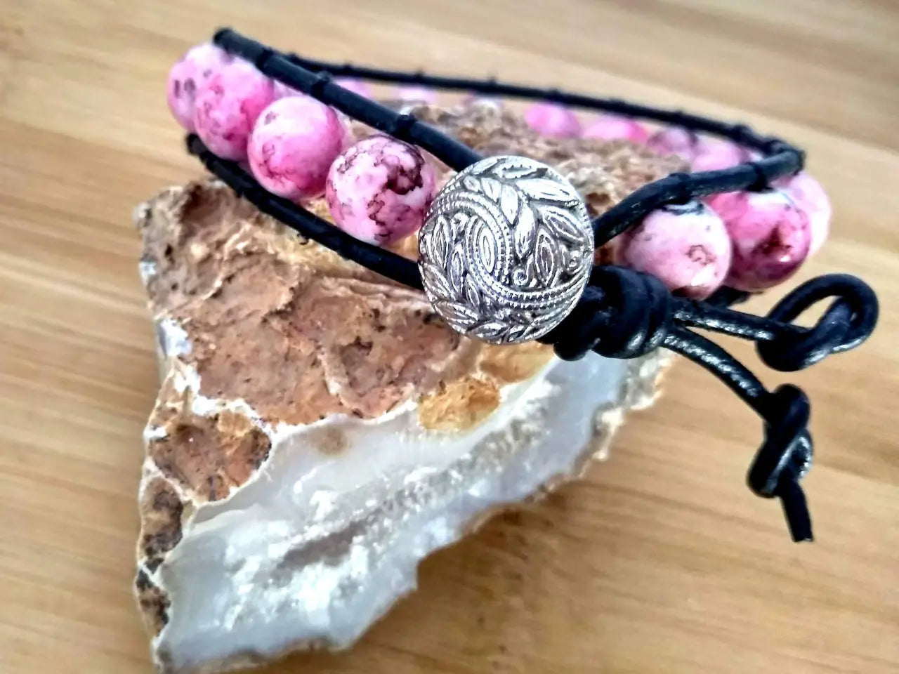 Bohemian style black leather bracelet with rhodonite beads.