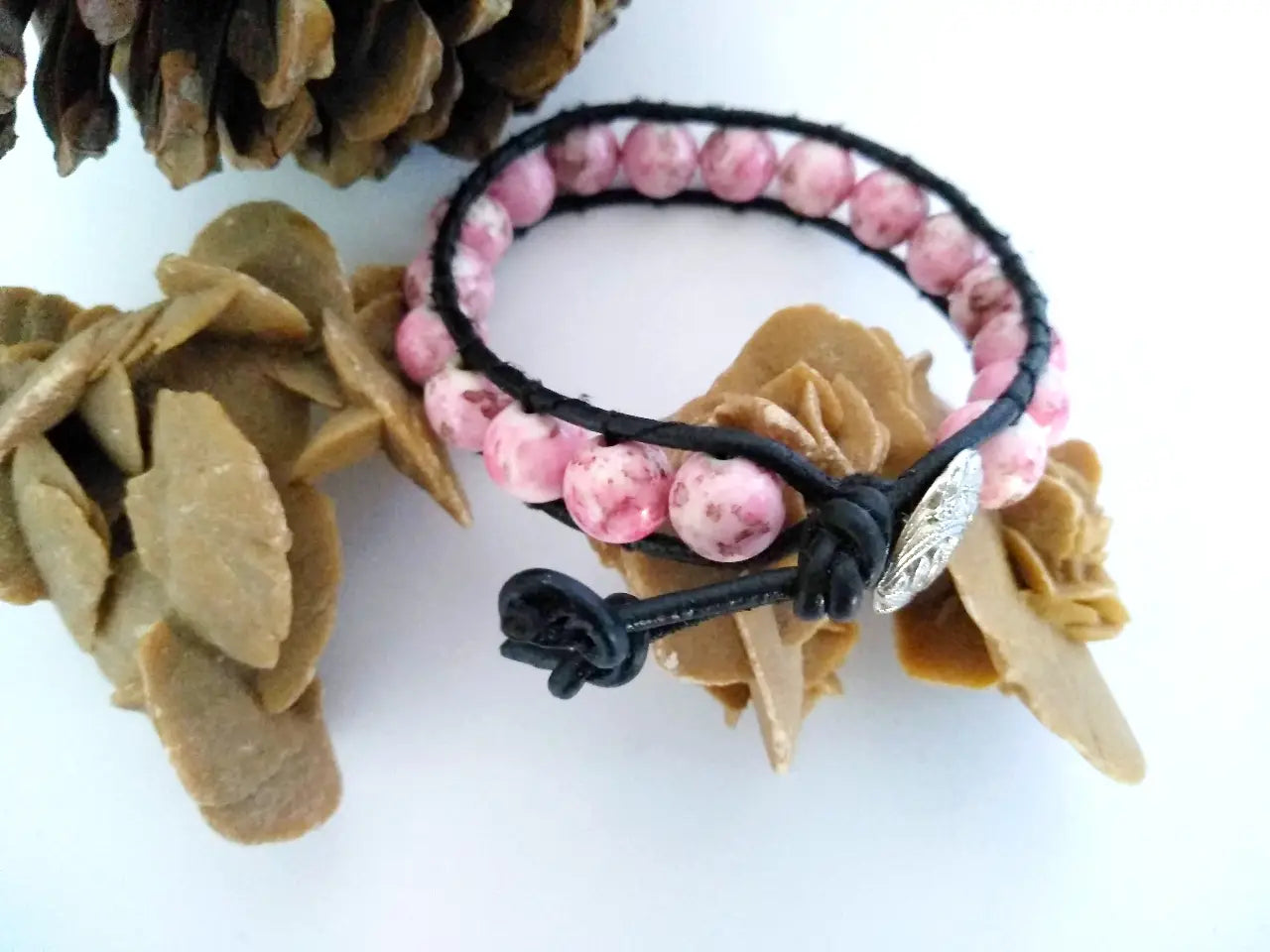 Bohemian style black leather bracelet with rhodonite beads.