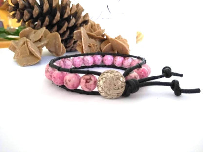 Bohemian style black leather bracelet with rhodonite beads.